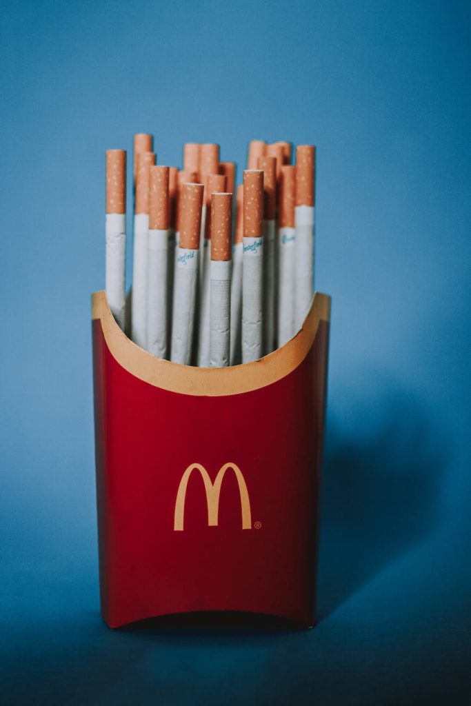 paper box with cigarettes on blue background