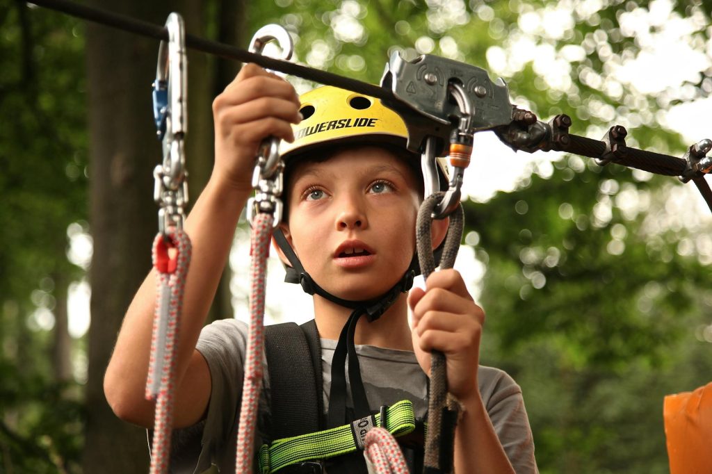 boy holding silver harness