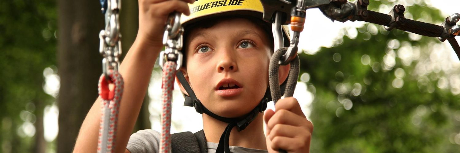 boy holding silver harness